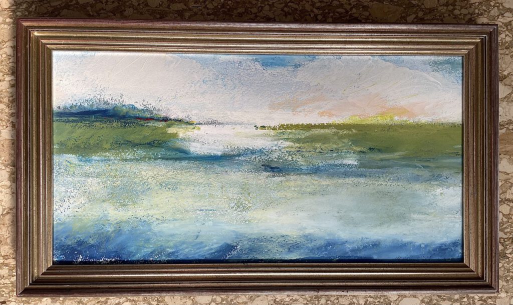 Framed abstract landscape painting in oil pastel and wax: horizontal bands of blue, green and white suggesting marsh and water, with a soft pink and yellow glow along the horizon